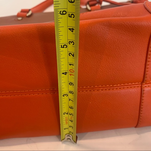 Orange handbag with a rust color body of bag and orange accent shoulder strap - Picture 16 of 16